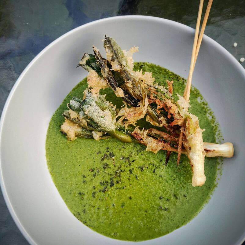 Baby leek and anchovy ‘Milanesa’, wild garlic mole and black sesame salt.